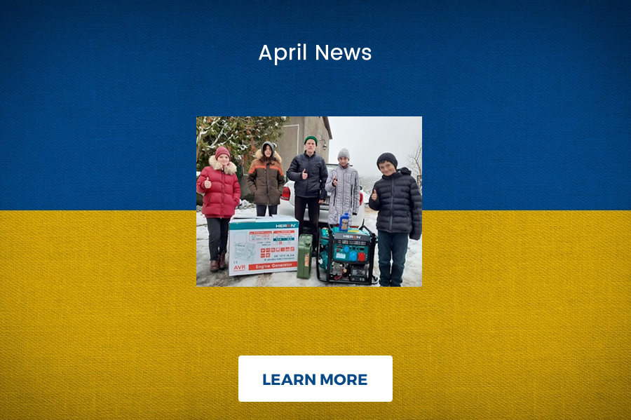 Photo of People next to generators.